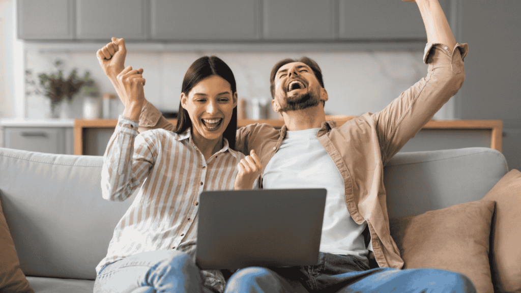 Happy couple investing online