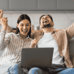 Happy couple investing online